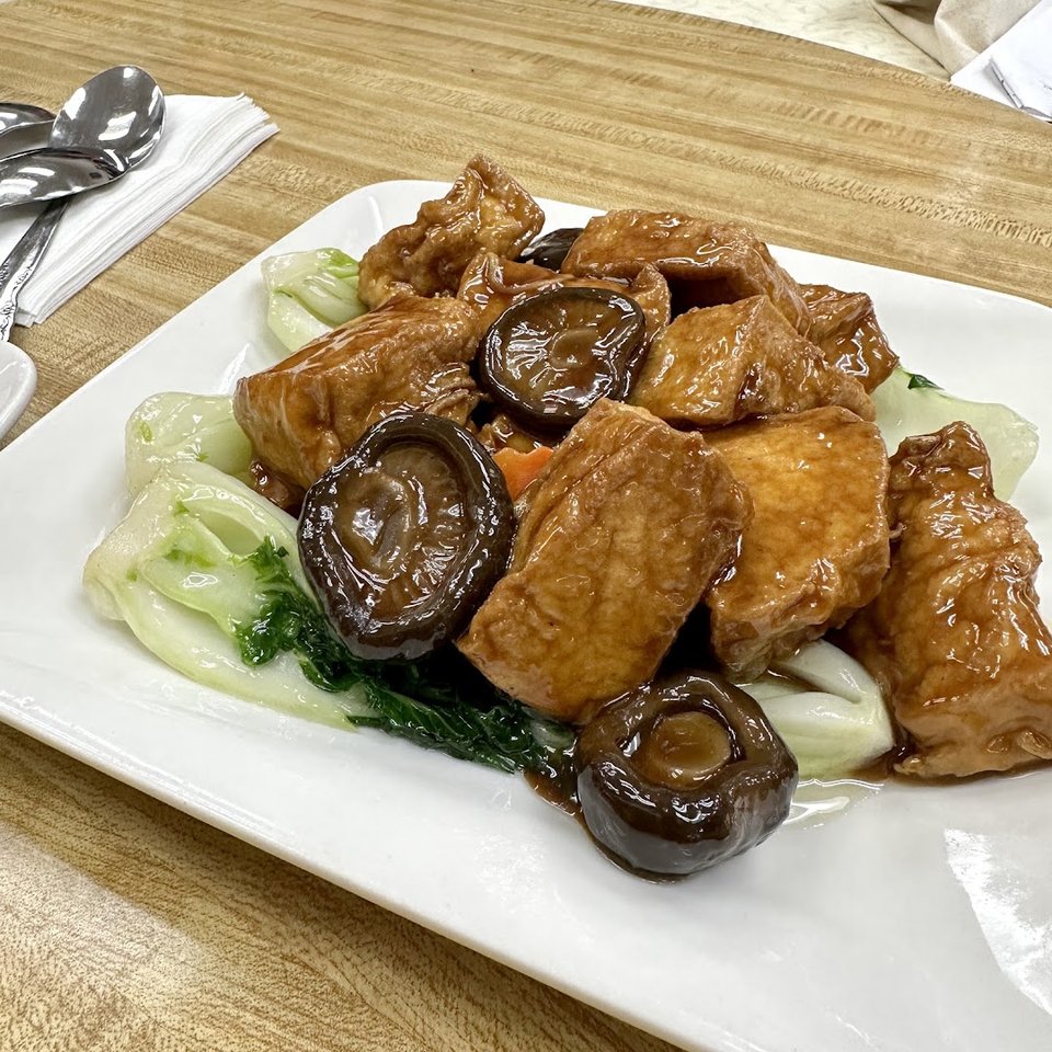 Cantonese restaurant dining area with basic seating.