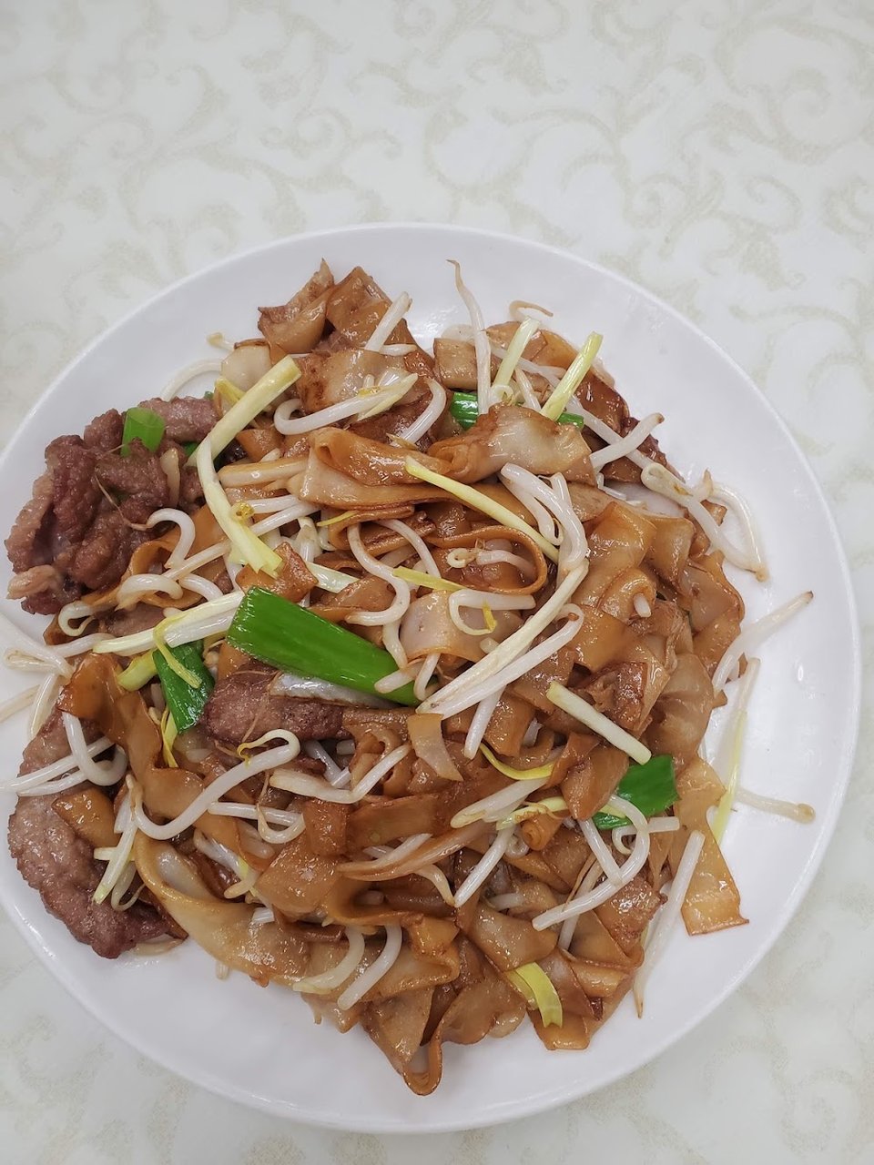 Printed menu with soups and noodle dishes.